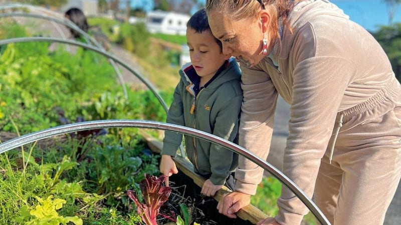 Hoterene and her son, Ouenuku, in the garden.