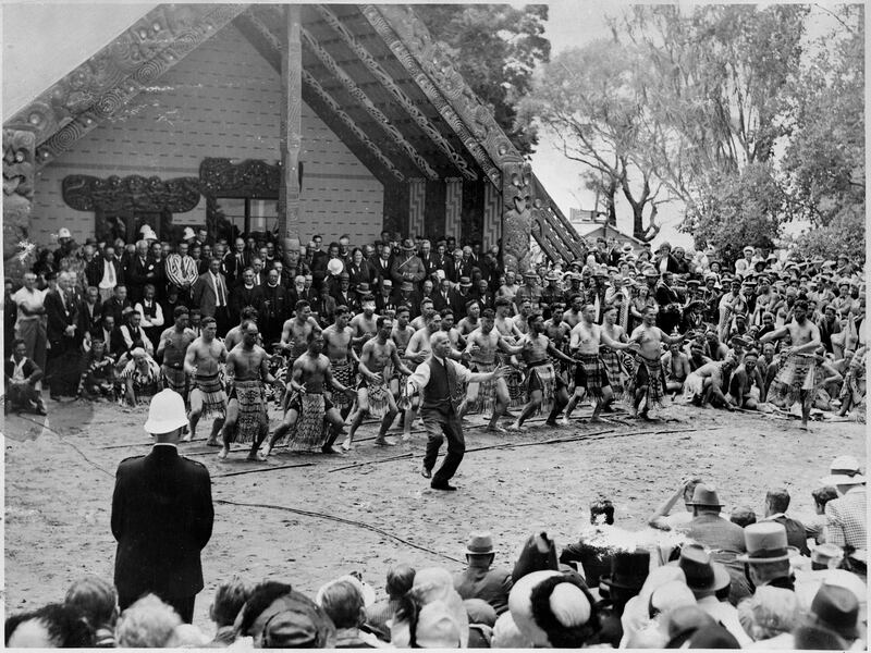 Sir Āpirana Ngata leads a haka in front of Te Whare Rūnanga in 1940.