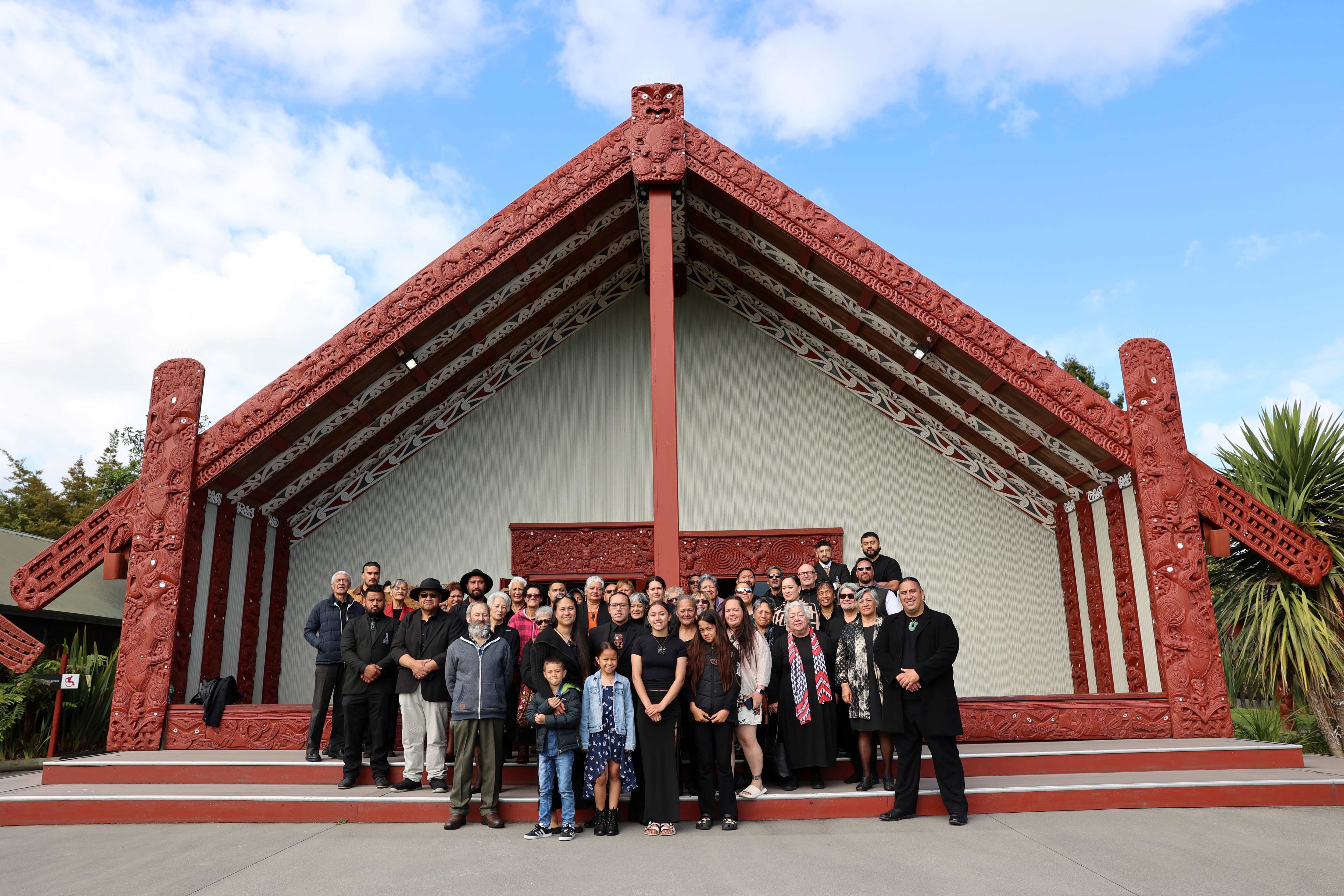 Proud whānau, close friends and Te Puia | NZMACI staff who were in attendance of the pōhiri for Grant Marunui gather outside of Te Aronui a Rua.