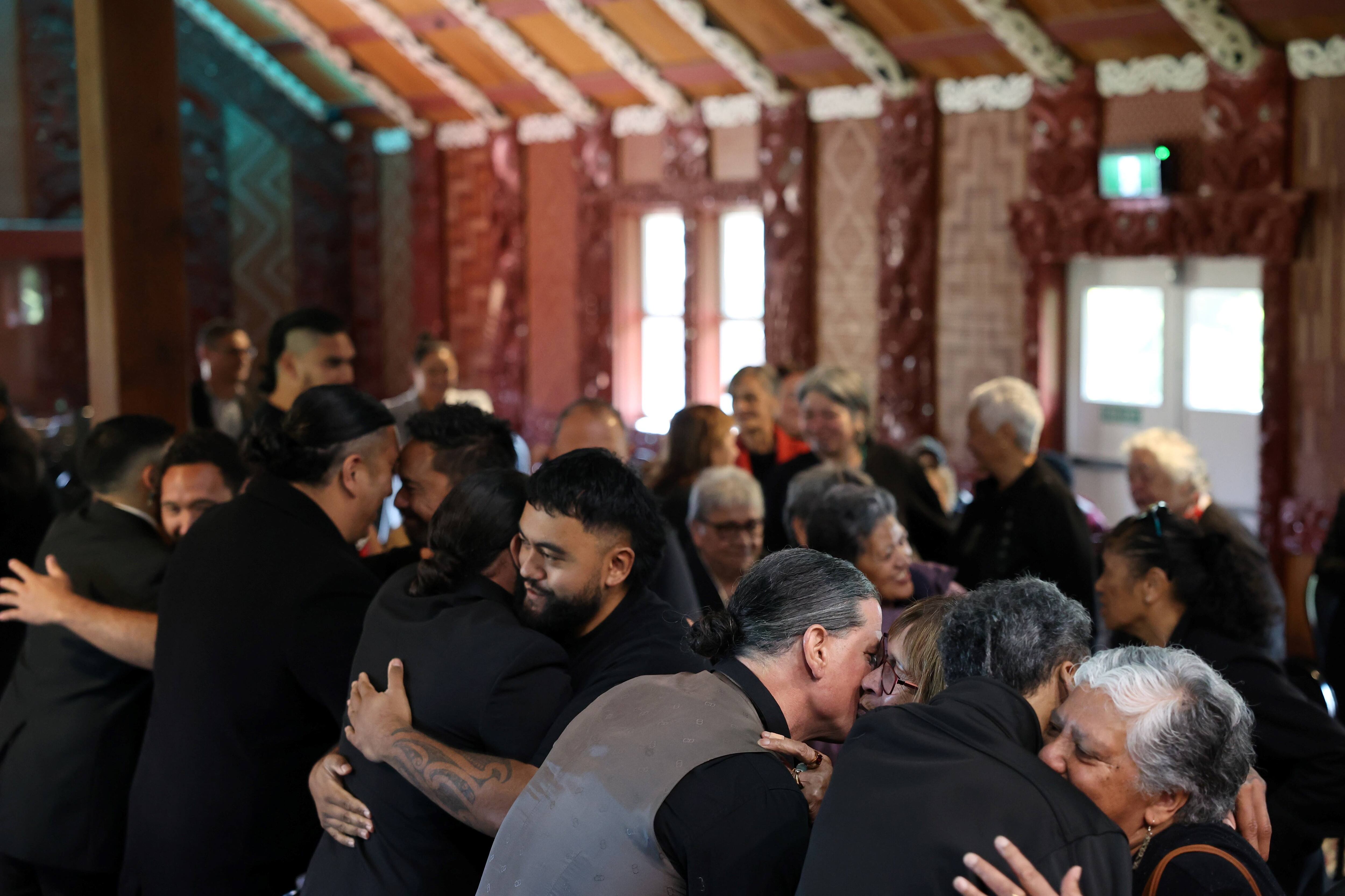 Whānau gathered in Te Aronui a Rua whare following the conclusion of the pōhiri for Grant Marunui.